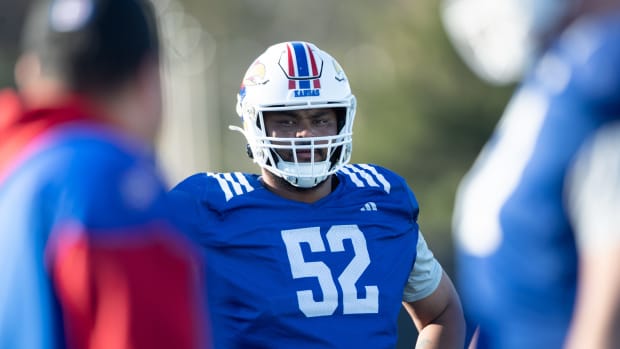 Kansas redshirt junior defensive tackle D.J. Withers (52) looks on during an outdoor practice Thursday, April 4, 2024.