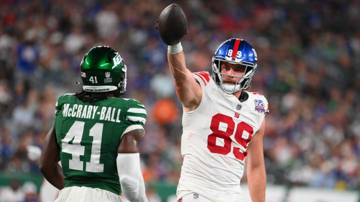 Aug 24, 2024; East Rutherford, New Jersey, USA; New York Giants tight end Jack Stoll (89) getures for a first down as New York Jets linebacker Marcelino McCrary-Ball (41) looks on during the second half at MetLife Stadium. Rich Barnes-USA TODAY Sports