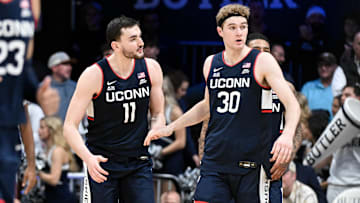 Connecticut Huskies forward Alex Karaban (11) and forward Liam McNeeley (30)