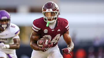 Sep 13, 2025; Starkville, Mississippi, USA; Mississippi State Bulldogs running back Fluff Bothwell (24) runs with the ball against the Alcorn State Braves during the second quarter at Davis Wade Stadium at Scott Field. Mandatory Credit: Wesley Hale-Imagn Images