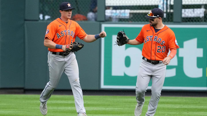 Jul 19, 2023; Denver, Colorado, USA; Houston Astros center fielder Jake Meyers (6) and right fielder Chas McCormick (20) celebrate defeating the Colorado Rockies at Coors Field
