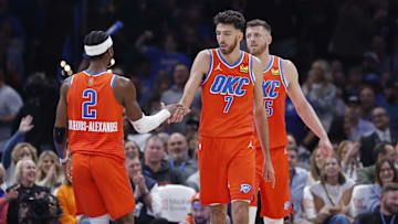Nov 11, 2025; Oklahoma City, Oklahoma, USA; Oklahoma City Thunder center Chet Holmgren (7) and Oklahoma City Thunder guard Shai Gilgeous-Alexander (2) celebrate after scoring against the Golden State Warriors during the second half at Paycom Center. Mandatory Credit: Alonzo Adams-Imagn Images