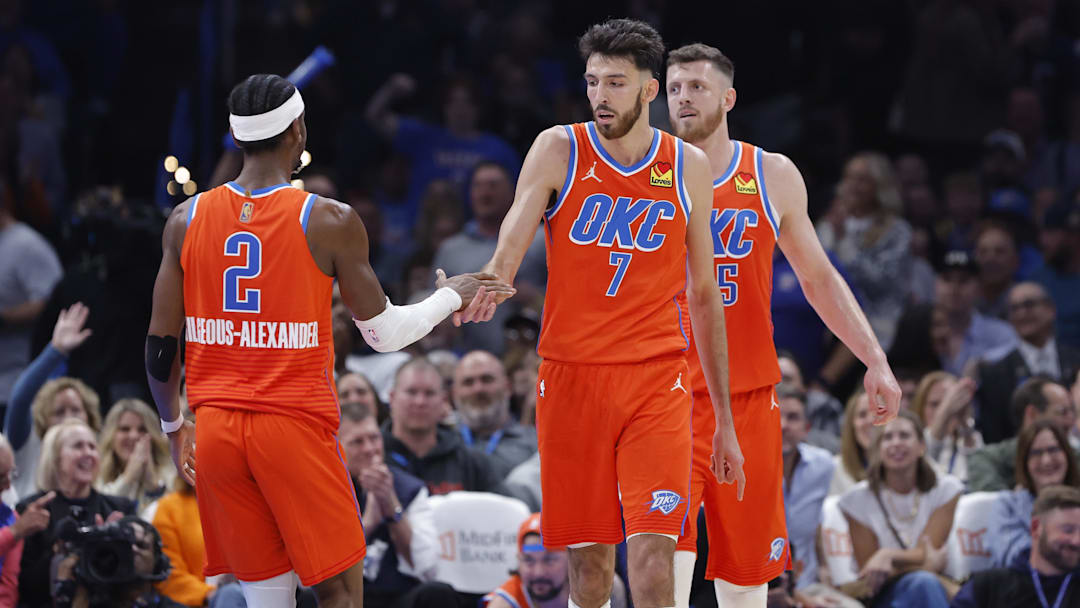 Nov 11, 2025; Oklahoma City, Oklahoma, USA; Oklahoma City Thunder center Chet Holmgren (7) and Oklahoma City Thunder guard Shai Gilgeous-Alexander (2) celebrate after scoring against the Golden State Warriors during the second half at Paycom Center.