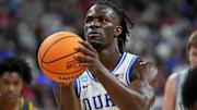 Mar 23, 2025; Raleigh, NC, USA; Duke Blue Devils guard Sion James (14) shoots for the basket against the Baylor Bears during the first half in the second round of the NCAA Tournament at Lenovo Center