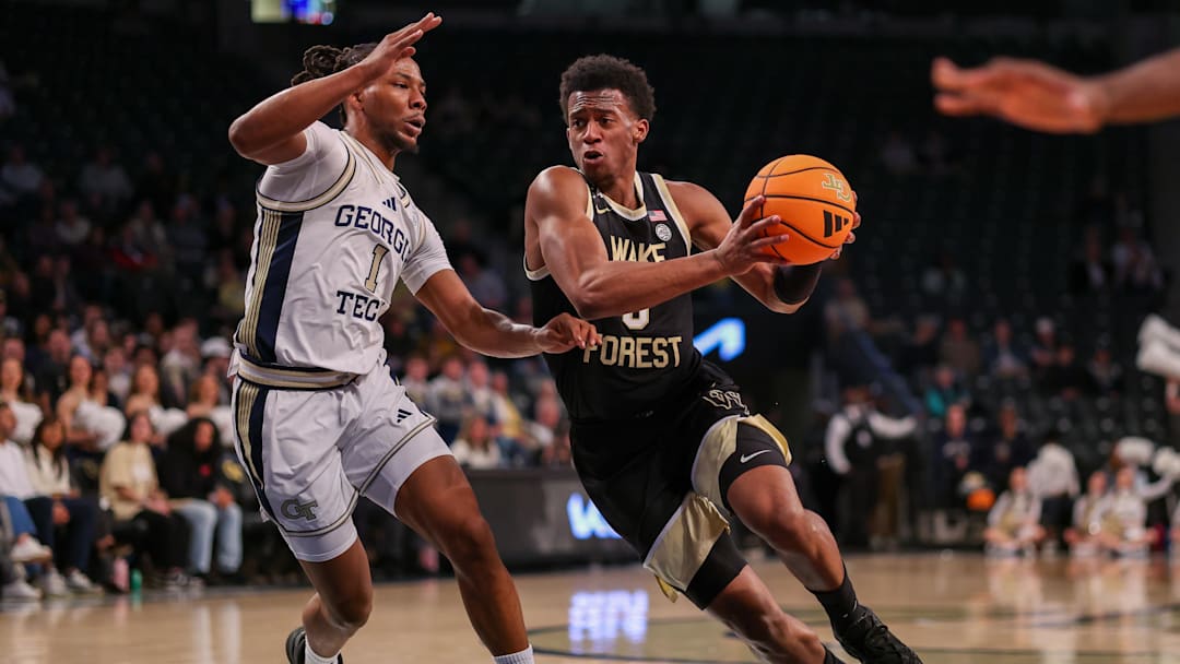 Feb 11, 2026; Atlanta, Georgia, USA; Wake Forest Demon Deacons guard Myles Colvin (6) drives on Georgia Tech Yellow Jackets guard Lamar Washington (1) in the first quarter at McCamish Pavilion. Mandatory Credit: Brett Davis-Imagn Images
