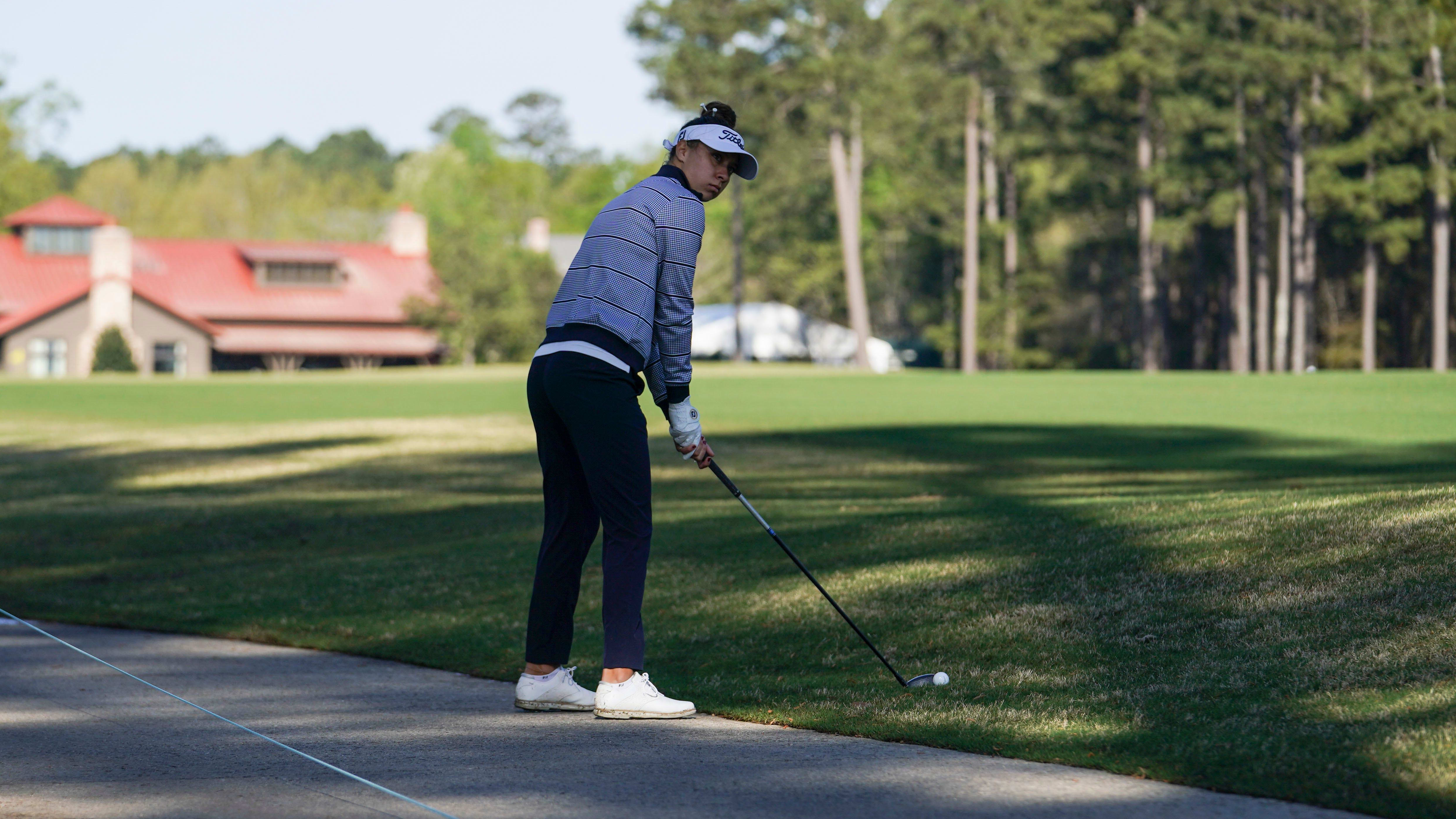 Anna Davis hits from the rough on the first fairway during the first round of the Augusta National Women's Amateur.