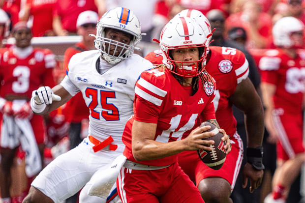 Nebraska Cornhuskers quarterback TJ Lateef scrambles against Houston Christian Huskies linebacker Mike Sylvalie.