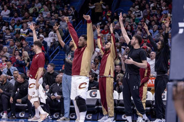 Cavaliers bench reacts to a basket being scored