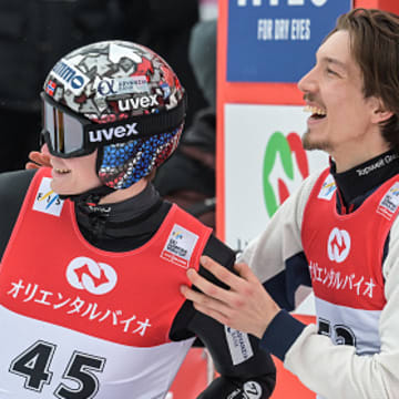 Marius Lindvik and Johann Andre Forfang celebrate at an FIS Ski Jumping World Cup competition in Sapporo, Japan.