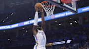 Oct 9, 2025; Oklahoma City, Oklahoma, USA; Oklahoma City Thunder guard Luguentz Dort (5) goes up for a dunk against the Charlotte Hornets during the second quarter of a game between the Charlotte Hornets and the Oklahoma City Thunder at Paycom Center. Mandatory Credit: Alonzo Adams-Imagn Images