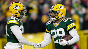 Green Bay Packers safety Xavier McKinney (29) celebrates intercepting a pass against San Francisco 49ers quarterback Brandon Allen with cornerback Carrington Valentine (24) during their football game Sunday, November 24, 2024, at Lambeau Field in Green Bay, Wisconsin.