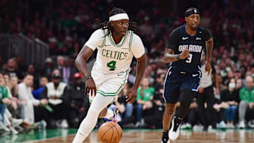 Apr 20, 2025; Boston, Massachusetts, USA; Boston Celtics guard Jrue Holiday (4) controls the ball during the second half against the Orlando Magic at TD Garden. Mandatory Credit: Bob DeChiara-Imagn Images