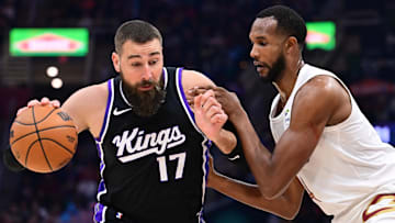 Apr 6, 2025; Cleveland, Ohio, USA; Sacramento Kings center Jonas Valanciunas (17) drives to the basket against Cleveland Cavaliers forward Evan Mobley (4) during the first half at Rocket Arena. Mandatory Credit: Ken Blaze-Imagn Images