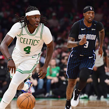 Apr 20, 2025; Boston, Massachusetts, USA; Boston Celtics guard Jrue Holiday (4) controls the ball during the second half against the Orlando Magic at TD Garden. Mandatory Credit: Bob DeChiara-Imagn Images
