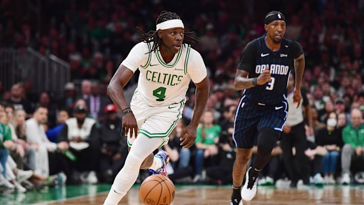 Apr 20, 2025; Boston, Massachusetts, USA; Boston Celtics guard Jrue Holiday (4) controls the ball during the second half against the Orlando Magic at TD Garden. Mandatory Credit: Bob DeChiara-Imagn Images