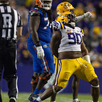 Nov 11, 2023; Baton Rouge, Louisiana, USA;  LSU Tigers defensive tackle Jacobian Guillory (90) reacts to a play against the Florida Gators during the second half at Tiger Stadium. Mandatory Credit: Stephen Lew-Imagn Images