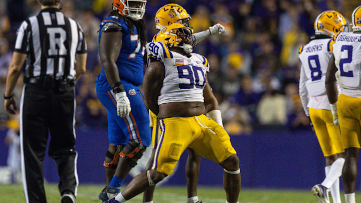 Nov 11, 2023; Baton Rouge, Louisiana, USA;  LSU Tigers defensive tackle Jacobian Guillory (90) reacts to a play against the Florida Gators during the second half at Tiger Stadium. Mandatory Credit: Stephen Lew-Imagn Images