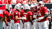 Sep 6, 2025; Raleigh, North Carolina, USA; North Carolina State Wolfpack huddle during the first half of the game against Virginia Cavaliers at Carter-Finley Stadium. Mandatory Credit: Jaylynn Nash-Imagn Images
