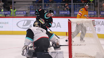 Div. Tarasova Hockey Club player, Alexei Kolosov (1) and Div...