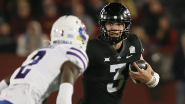 Iowa State Cyclones' quarterback Rocco Becht (3) runs with the ball around Kansas Jayhawks wide receiver Lawrence Arnold (2) during the first quarter at Jack Trice Stadium on Saturday, Nov. 4, 2023, in Ames, Iowa.