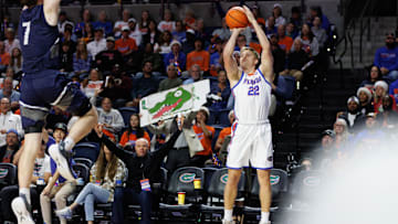Dec 21, 2024; Gainesville, Florida, USA; Florida Gators guard Bennett Andersen (22) attempts a three point basket against the North Florida Ospreys during the second half at Exactech Arena at the Stephen C. O'Connell Center. Mandatory Credit: Matt Pendleton-Imagn Images