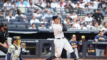 Mar 29, 2025; Bronx, New York, USA; New York Yankees right fielder Aaron Judge (99) hits a two run home in the fourth inning against the Milwaukee Brewers at Yankee Stadium. Mandatory Credit: Wendell Cruz-Imagn Images