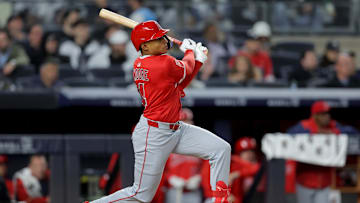Jun 16, 2025; Bronx, New York, USA; Los Angeles Angels second baseman Christian Moore (4) follows through on a triple against the New York Yankees during the eighth inning at Yankee Stadium. Mandatory Credit: Brad Penner-Imagn Images