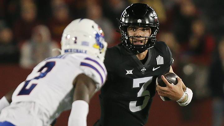 Iowa State Cyclones' quarterback Rocco Becht (3) runs with the ball around Kansas Jayhawks wide receiver Lawrence Arnold (2) during the first quarter at Jack Trice Stadium on Saturday, Nov. 4, 2023, in Ames, Iowa.