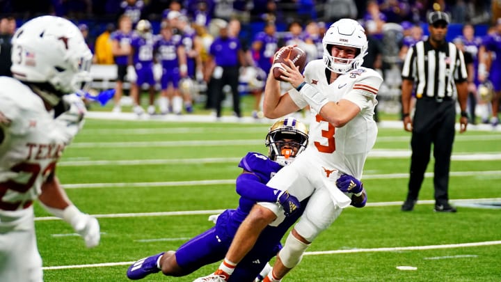 Jan 1, 2024; New Orleans, LA, USA; Texas Longhorns quarterback Quinn Ewers (3) is pressured by Washington Huskies safety Mishael Powell (3) during the fourth quarter in the 2024 Sugar Bowl college football playoff semifinal game at Caesars Superdome. Mandatory Credit: John David Mercer-USA TODAY Sports