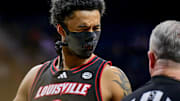 Feb 16, 2025; South Bend, Indiana, USA; Louisville Cardinals forward James Scott (0) talks to an official in the first half against the Notre Dame Fighting Irish at the Purcell Pavilion. 