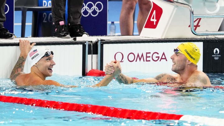 Jul 27, 2024; Nanterre, France; Caeleb Dressel (USA) and Kyle Chalmers (Australia) in the men’s 4 x 100-meter freestyle relay preliminary heats during the Paris 2024 Olympic Summer Games at Paris La Défense Arena. Mandatory Credit: Rob Schumacher-USA TODAY Sports