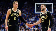 Purdue Boilermakers guard Fletcher Loyer (2) fives guard Braden Smith (3)