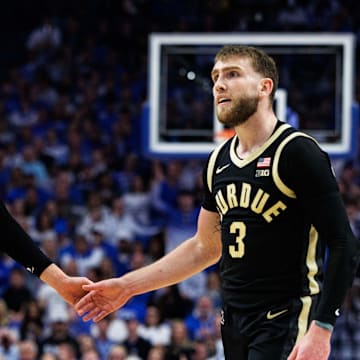 Purdue Boilermakers guard Fletcher Loyer (2) fives guard Braden Smith (3)