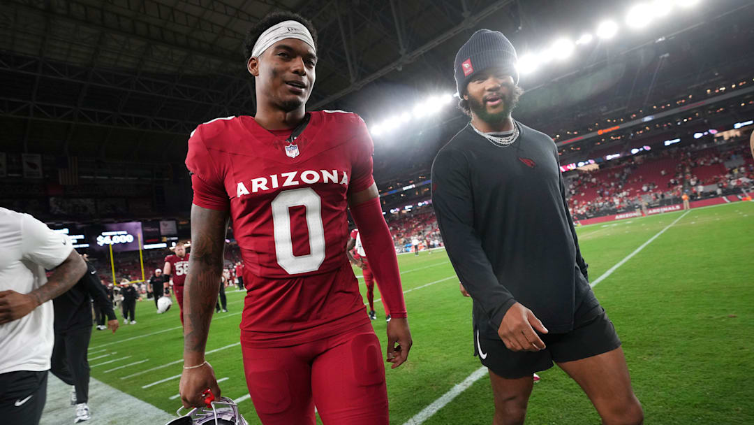 Arizona Cardinals cornerback Will Johnson (0) and quarterback Kyler Murray walk off the field after their 20-17 preseason win over the Kansas City Chiefs at State Farm Stadium on Aug. 9, 2025.