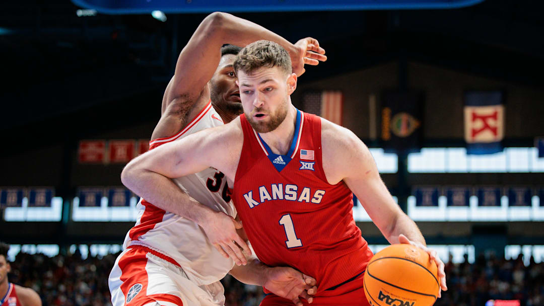 Mar 8, 2025; Lawrence, Kansas, USA; Kansas Jayhawks center Hunter Dickinson (1) drives to the basket during the second half against the Arizona Wildcats at Allen Fieldhouse. Mandatory Credit: William Purnell-Imagn Images