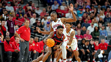 Mar 24, 2022; San Antonio, TX, USA; Houston Cougars guard Jamal Shead (1) drives to the basket against Arizona Wildcats guard Dalen Terry (4) during the second half in the semifinals of the South regional of the men's college basketball NCAA Tournament at AT&T Center. Mandatory Credit: Daniel Dunn-Imagn Images
