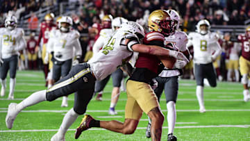 Nov 15, 2025; Chestnut Hill, Massachusetts, USA; Boston College Eagles wide receiver Reed Harris (4) scores a touchdown while being tackled by Georgia Tech Yellow Jackets linebacker Kyle Efford (44) during the second half at Alumni Stadium. Mandatory Credit: Bob DeChiara-Imagn Images