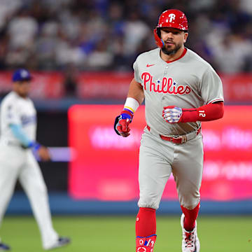 Sep 15, 2025; Los Angeles, California, USA; Philadelphia Phillies outfielder Kyle Schwarber (12) rounds the bases after hitting a solo home run against the Los Angeles Dodgers in the first inning at Dodger Stadium. Mandatory Credit: Gary A. Vasquez-Imagn Images