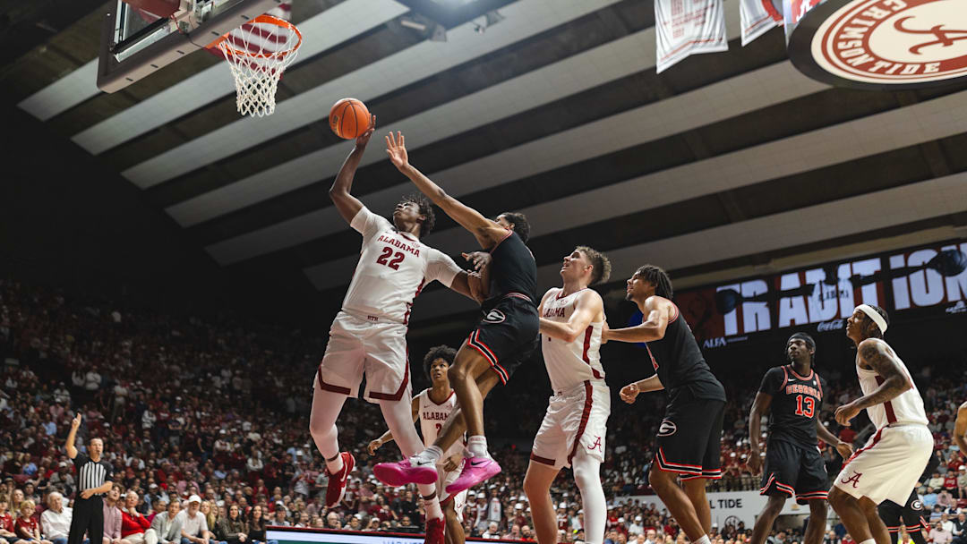 Feb 1, 2025; Tuscaloosa, Alabama, USA; Alabama Crimson Tide forward Aiden Sherrell (22) grabs a rebound against Georgia Bulldogs guard De'Shayne Montgomery (2) during the first half at Coleman Coliseum. 