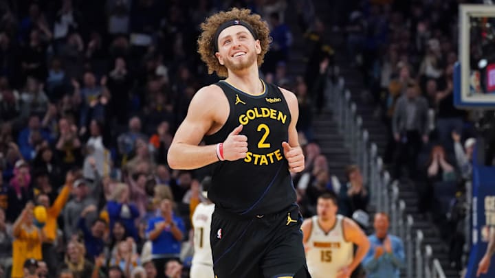Feb 22, 2026; San Francisco, California, USA;  Golden State Warriors guard Brandin Podziemski (2) smiles after scoring against the Denver Nuggets in the fourth quarter at Chase Center. Mandatory Credit: David Gonzales-Imagn Images