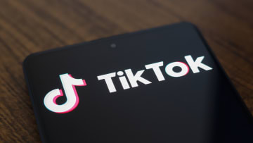 In this photo illustration, the TikTok logo is displayed on...