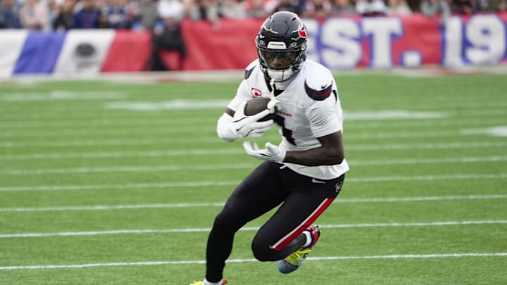 Oct 13, 2024; Foxborough, Massachusetts, USA; Houston Texans wide receiver Stefon Diggs (1) runs with the ball after making a catch against the New England Patriots during the first half at Gillette Stadium. Mandatory Credit: Gregory Fisher-Imagn Images