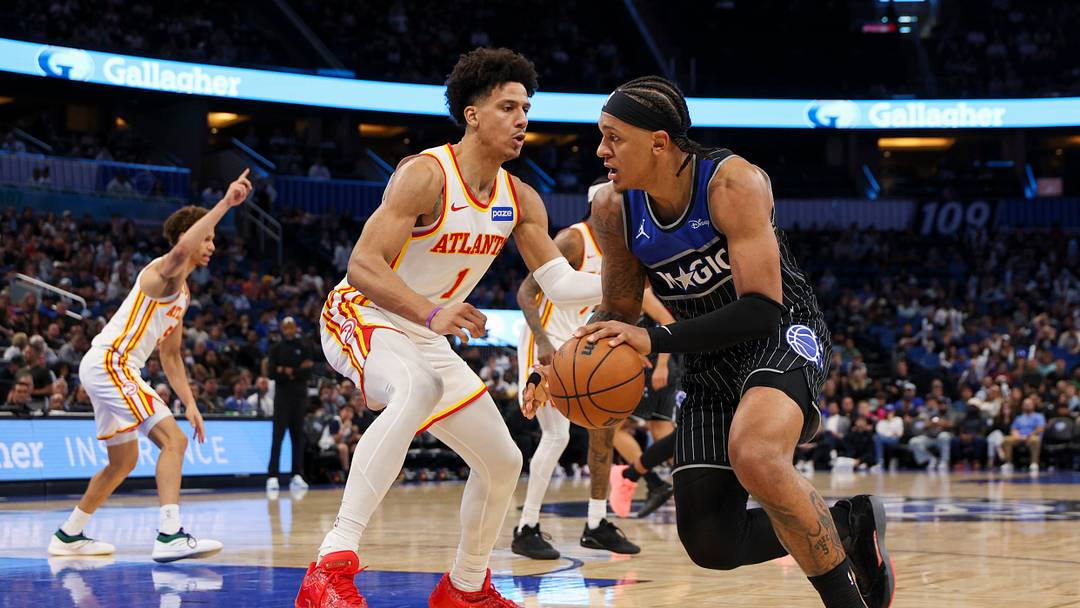 Apr 1, 2026; Orlando, Florida, USA; Orlando Magic forward Paolo Banchero (5) is guarded by Atlanta Hawks forward Jalen Johnson (1) in the third quarter at Kia Center. Mandatory Credit: Nathan Ray Seebeck-Imagn Images