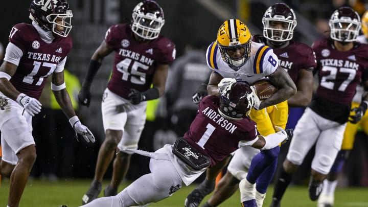 Nov 26, 2022; College Station, Texas, USA; Texas A&M Aggies defensive back Bryce Anderson (1) and LSU Tigers wide receiver Malik Nabers (8) in action during the game between the Texas A&M Aggies and the LSU Tigers at Kyle Field. Mandatory Credit: Jerome Miron-USA TODAY Sports