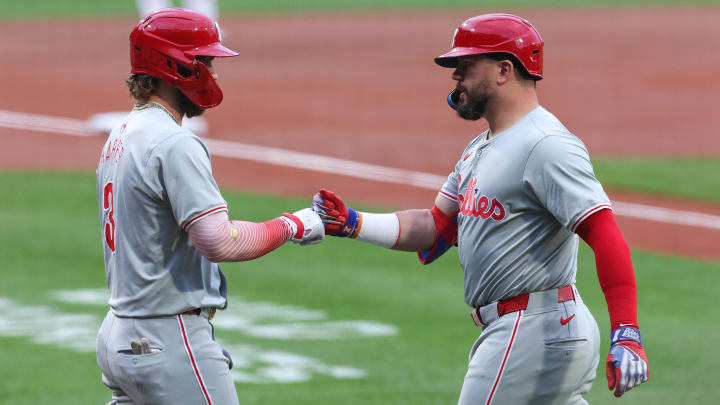 Jun 11, 2024; Boston, Massachusetts, USA; Philadelphia Phillies designated hitter Kyle Schwarber (12) celebrates with Philadelphia Phillies first baseman Bryce Harper (3) after a leadoff solo home run during the first inning against the Boston Red Sox at Fenway Park.