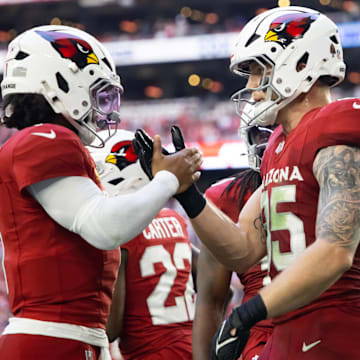 Jan 5, 2025; Glendale, Arizona, USA; Arizona Cardinals quarterback Kyler Murray (1) celebrates a touchdown with tight end Trey McBride (85) against the San Francisco 49ers at State Farm Stadium. Mandatory Credit: Mark J. Rebilas-Imagn Images
