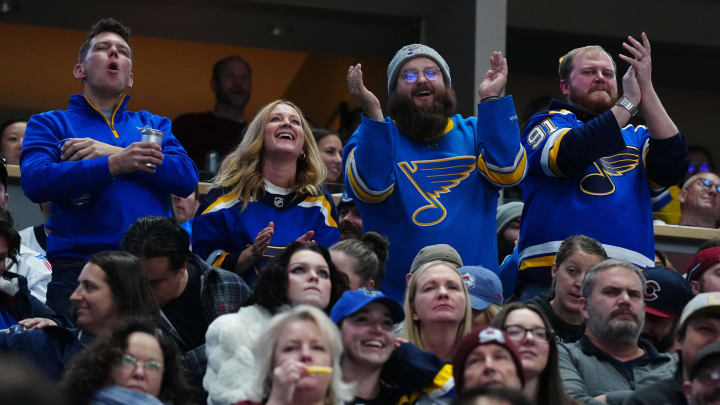 Nov 11, 2023; Denver, Colorado, USA; St. Louis Blues fans celebrate a goal against the Colorado Avalanche in the first period at Ball Arena. Mandatory Credit: Ron Chenoy-USA TODAY Sports