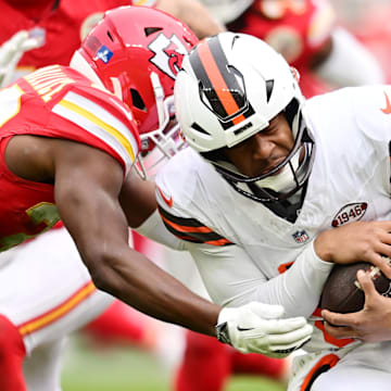 Kansas City Chiefs cornerback Christian Roland-Wallace (30) tackles Cleveland Browns quarterback Jameis Winston (5) during the second half at Huntington Bank Field.