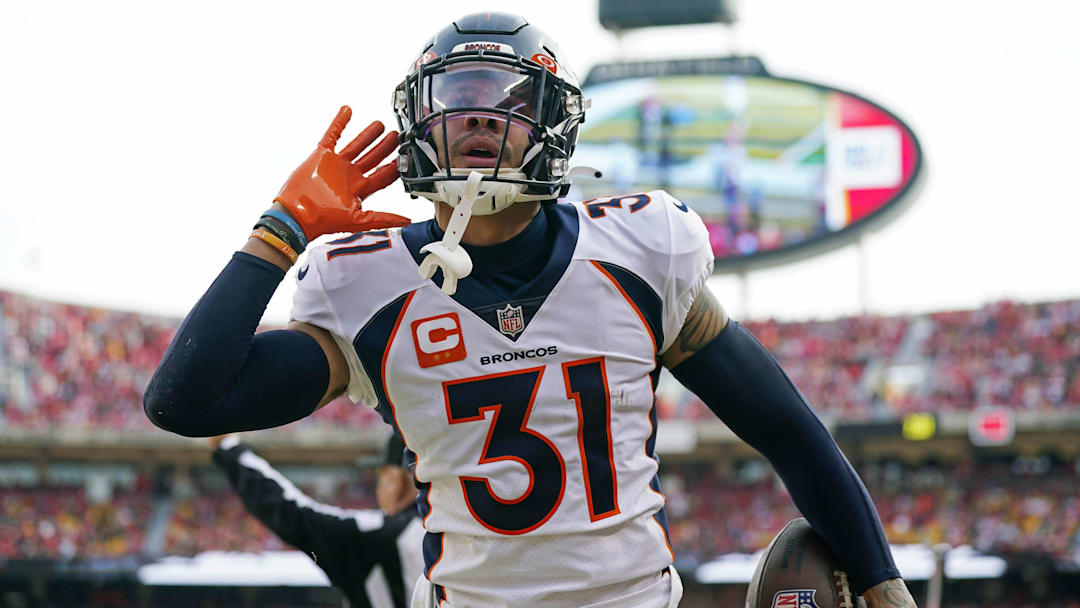 Jan 1, 2023; Kansas City, Missouri, USA; Denver Broncos safety Justin Simmons (31) celebrates after an interception during the first half against the Kansas City Chiefs at GEHA Field at Arrowhead Stadium. Mandatory Credit: Jay Biggerstaff-Imagn Images