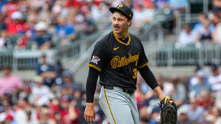 Jun 29, 2024; Cumberland, Georgia, USA; Pittsburgh Pirates pitcher Paul Skenes (30) walks to the dugout after pitching the first inning against Atlanta Braves during the first inning at Truist Park. Mandatory Credit: Jordan Godfree-USA TODAY Sports